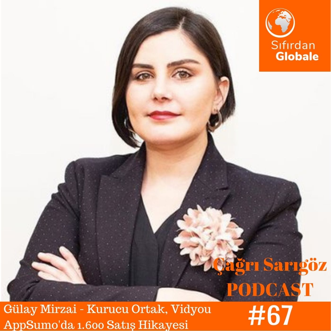 A woman in a suit is standing in front of a camera.