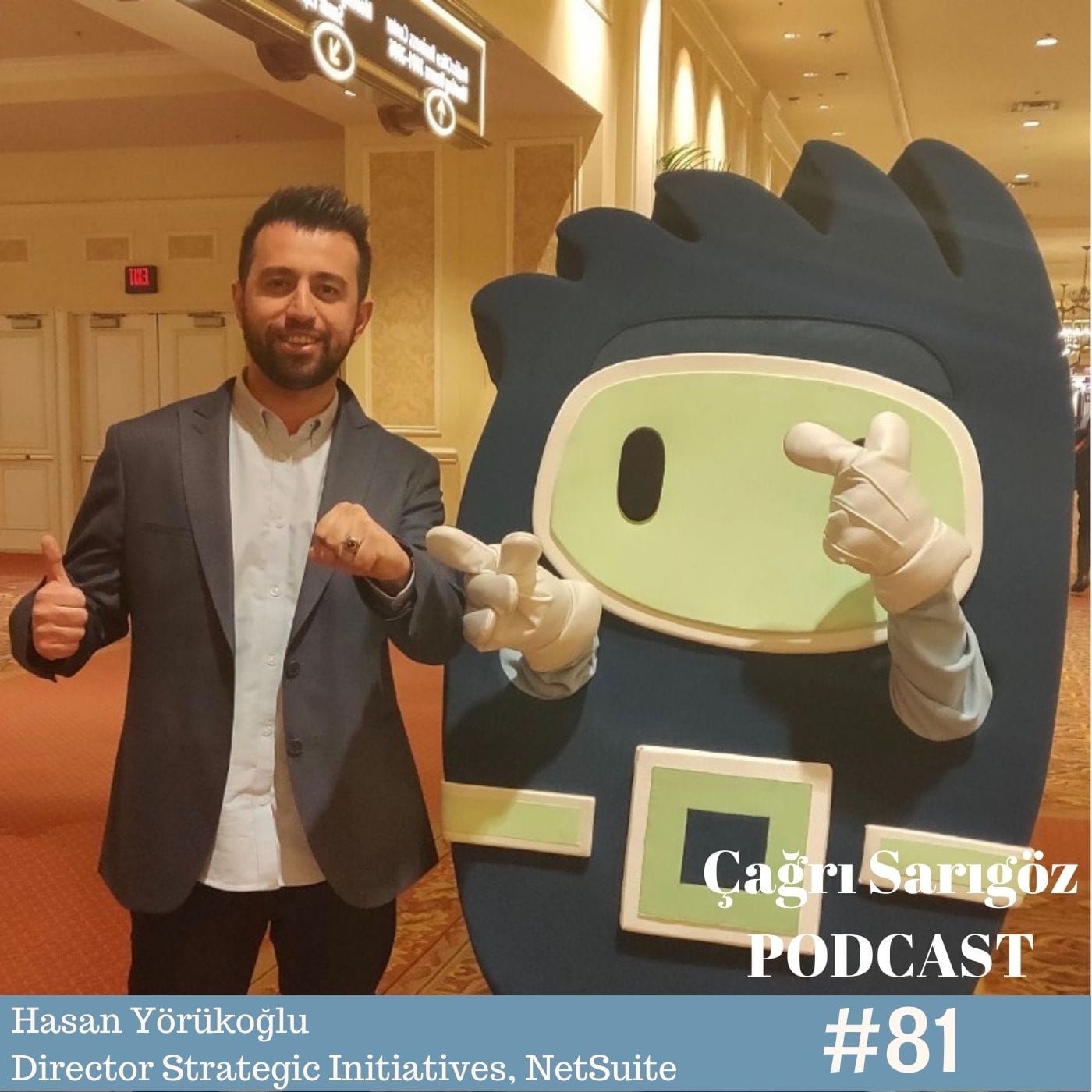 A man and a woman standing next to a cartoon character.